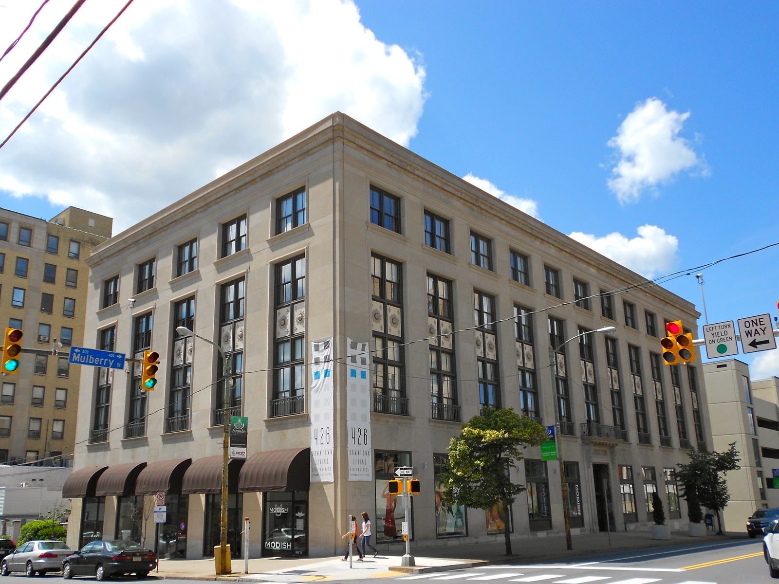 A stone-faced commercial building on the corner of Mulberry Street in downtown Scranton